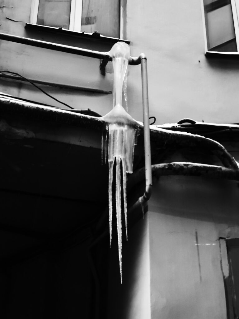 a frozen pipe covered with ice